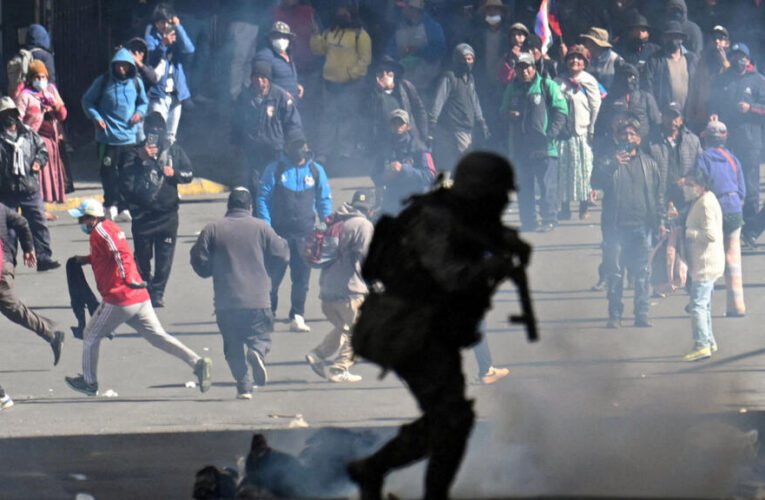 Bolivian president slashes salary by 50% to calm protests
