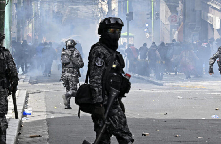 Police, protesters clash in new marches against Bolivian leader