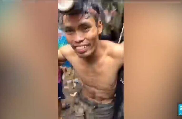 Rescuers pull four villagers trapped in a flooded cave during ten days