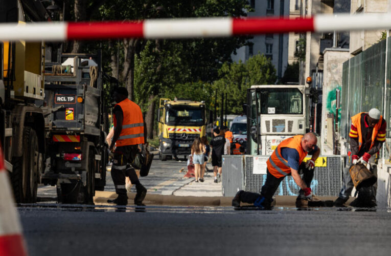 ‘I don’t have a choice’: Paris workers struggle under historic heatwave
