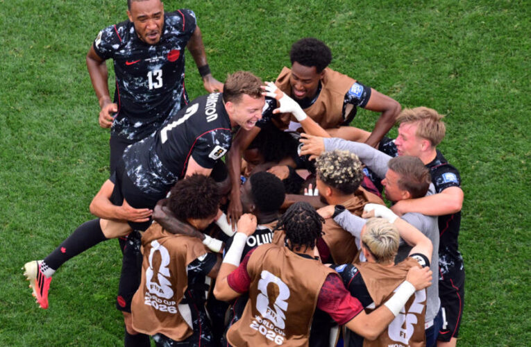 Canada reach last 16 with stoppage-time win over South Africa