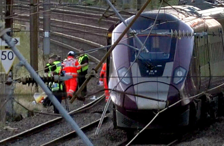 One dead and dozens injured in train collision north of London