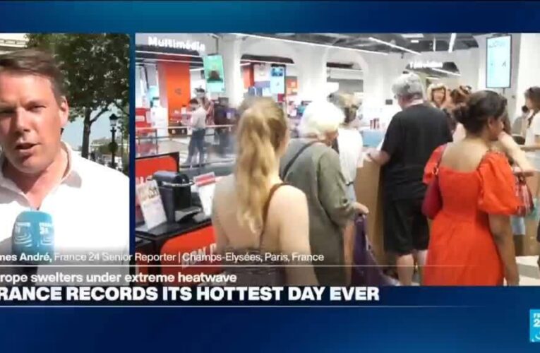 Tourists on Champs-Élysées seek refuge from heat as more records tumble