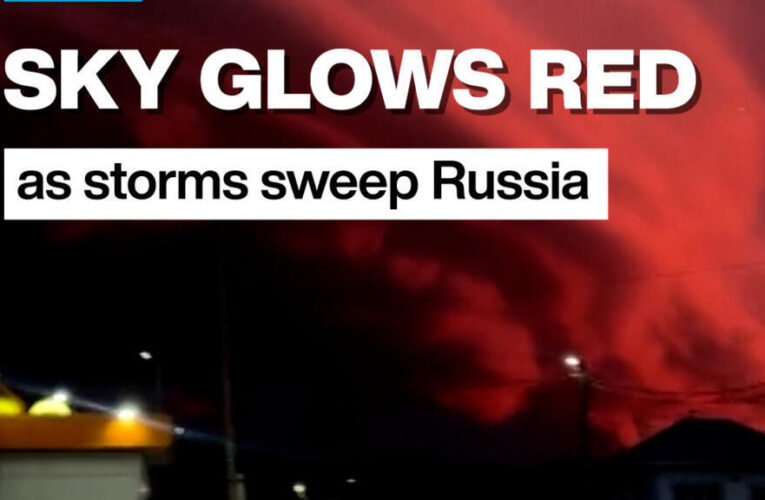 Sky glows red as storms sweep Russia